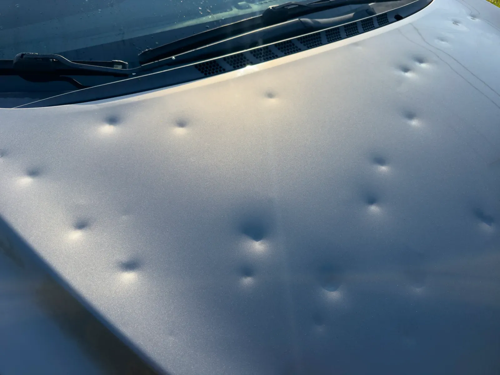 Before: hail-damaged hood & roof